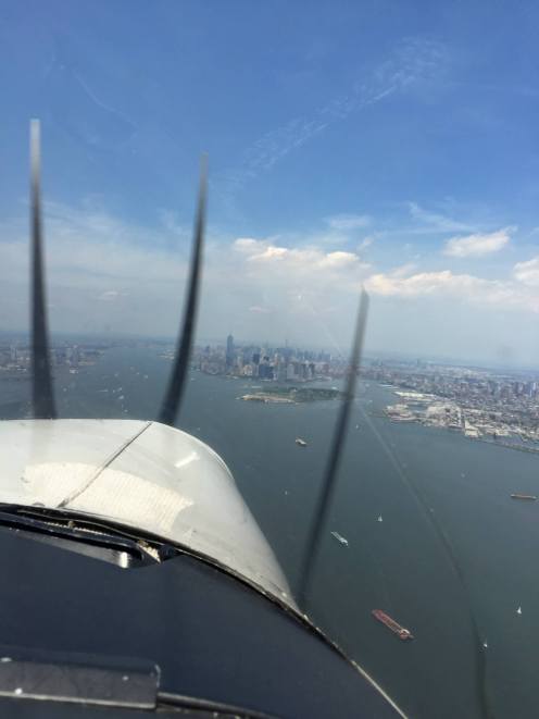 From the front seat of the plane, coming in hot over Manhattan