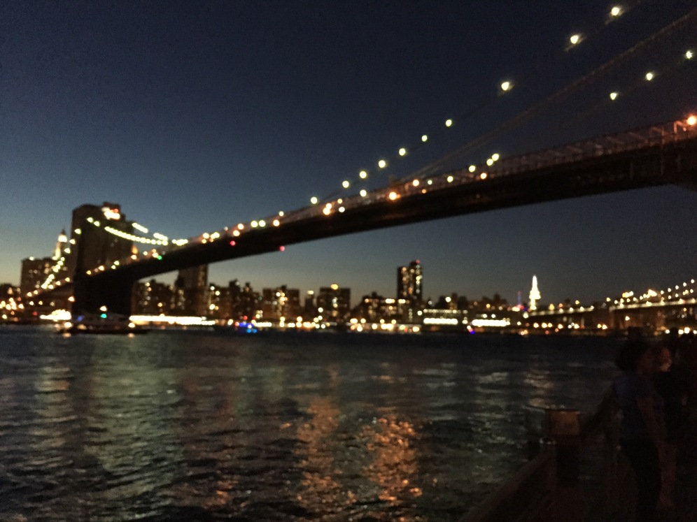 The Brooklyn Bridge lit up just after sunset